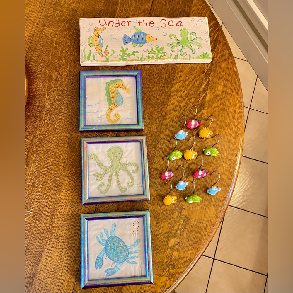 3 Pottery Barn framed embroidery sea creatures, 12 shower hooks, and wall art